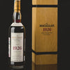 The Macallan 1926 60-year-old single malt Scotch whisky bottle beside its wooden presentation case