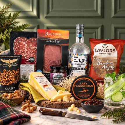 Edinburgh Gin hamper with Scottish cheese, charcuterie, crisps, savoury snacks and a served gin drink.