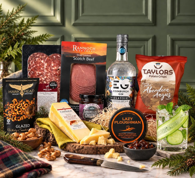 Edinburgh Gin hamper with Scottish cheese, charcuterie, crisps, savoury snacks and a served gin drink.