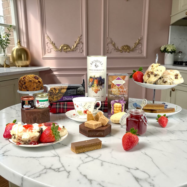 Luxury Easter gift hamper with chocolates, spring flowers and gourmet treats beautifully presented for Easter gifting.