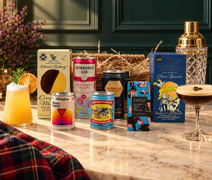 The Wee Cocktail Hamper with cocktail cans, Island Bakery biscuits and COCO mini chocolate. Glassware, shaker and garnishes shown as serving suggestions.